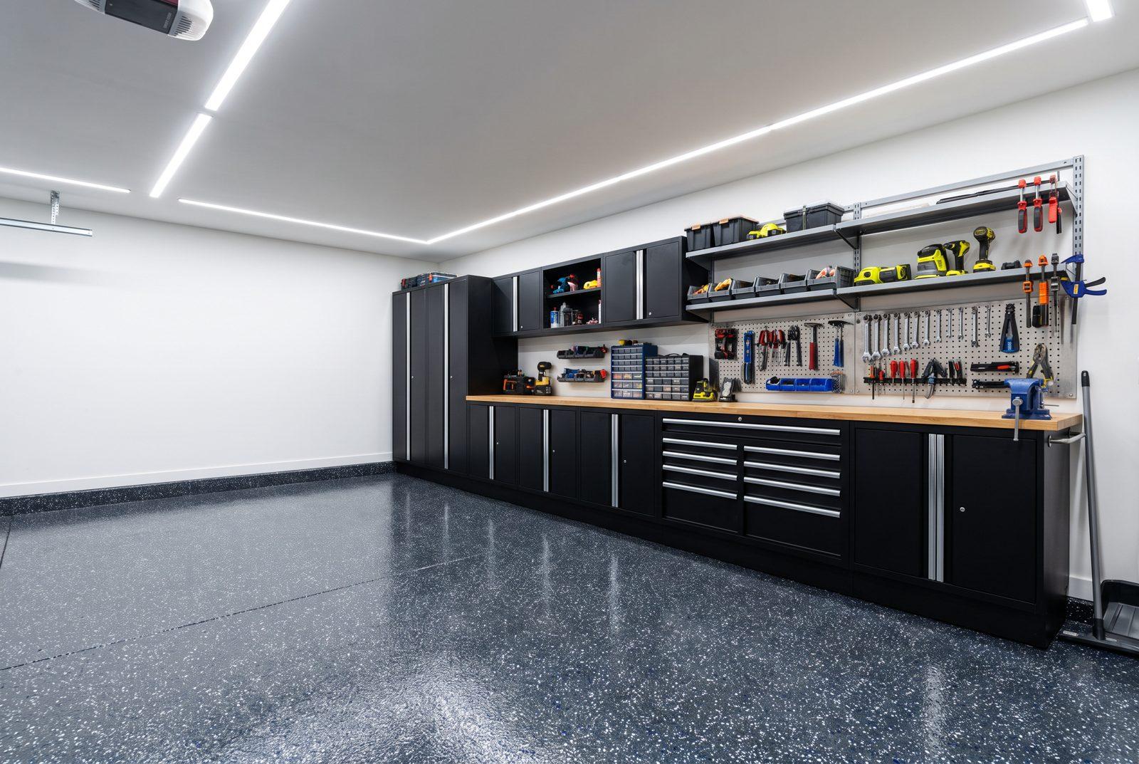 Modular black cabinet wall in a finished garage