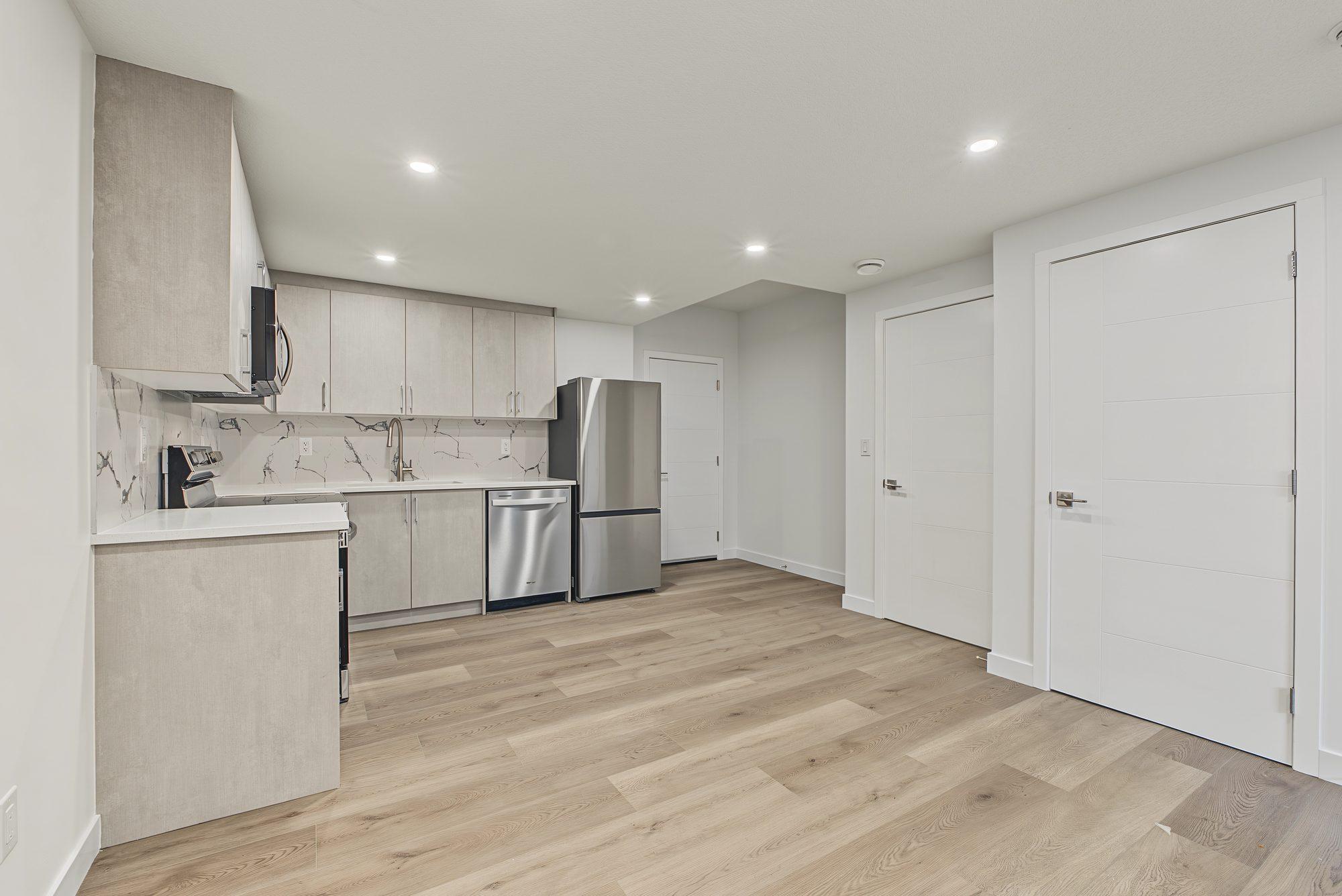 Kitchen and the hall toward the bedroom and bathroom doors