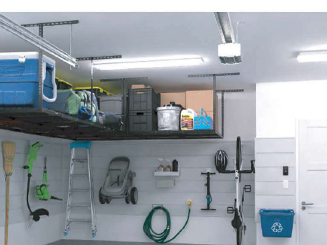 An overhead ceiling rack loaded with totes above a slatwall garage with a bike, ladder and hose